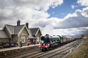 The Flying Scotsman passed through Ribblehead Train Station in the Yorkshire Dales National Park when the Settle-Carlisle railway line reopened after floods.
