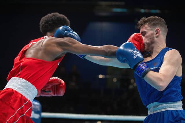 Scott Richards (blue) is beaten via split decision against Germany's Salah Ibrahim (red) at the World Boxing Cup GB Open at the EIS, Sheffield. (Picture: Bruce Rollinson)
