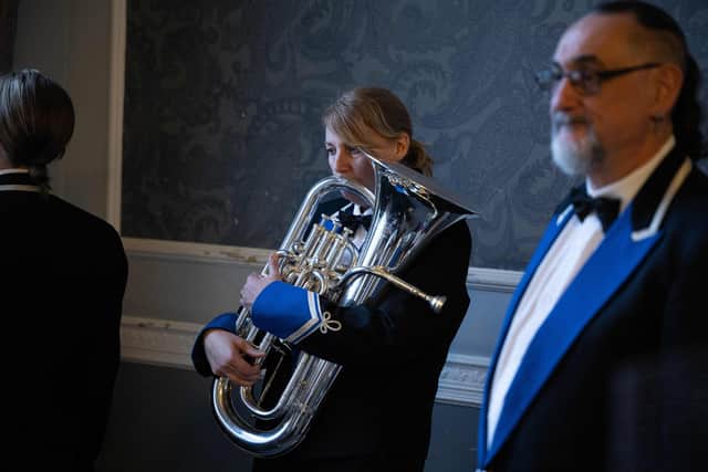 TOPSHOT - Musicians from the South Yorkshire Police band prepare to compete in the Yorkshire Brass Band Championships in the Town Hall in Huddersfield, northern England on March 4, 2023. - Over fifty bands, across 5 grading sections, will compete for the honour of representing Yorkshire at the finals of the National Brass Band Championships of Great Britain - the largest brass band competition series in the World. (Photo by OLI SCARFF / AFP) (Photo by OLI SCARFF/AFP via Getty Images)