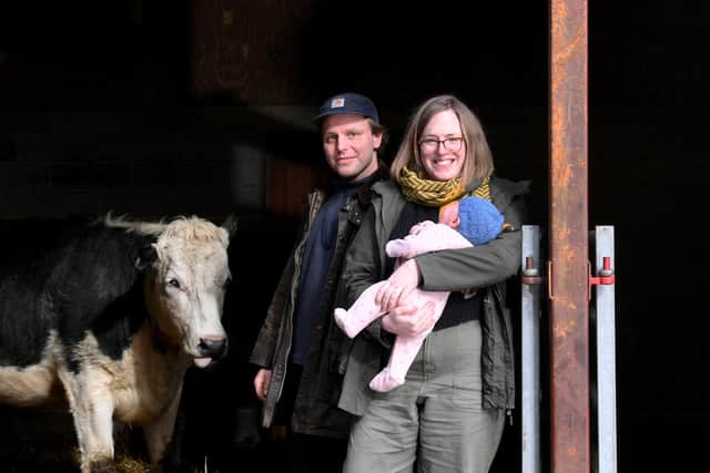 Claire Booth-Kurpnieks, Claire's husband Klavs and baby daughter Anna at Uppergate Farm
