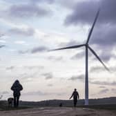 People walking their dogs at Hook Moor Wind Farm, near Leeds. PIC: Danny Lawson/PA Wire