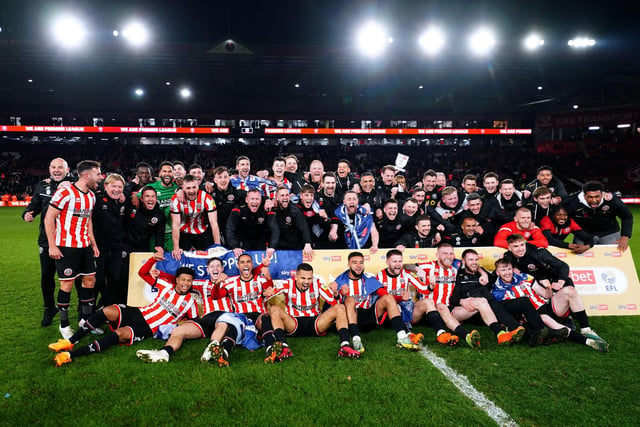 Sheffield United players and staff members celebrate being promoted to the Premier League after winning their the Sky Bet Championship match at Bramall Lane, Sheffield. Photo credit: David Davies/PA Wire.