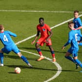 CROWDED OUT: England's Omari Forson is surrounded by Icelandic blue