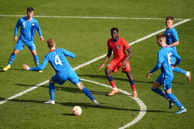CROWDED OUT: England's Omari Forson is surrounded by Icelandic blue