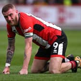 ON HIS KNEES: Sheffield United's stand-in captain Oli McBurnie