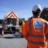 Workers from Thames Water delivering a temporary water supply from a tanker, as ministers have continued efforts to reassure Thames Water customers that their supplies would not be affected as a result of the financial troubles faced by the firm. Picture: Andrew Matthews/PA Wire
