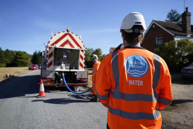 Workers from Thames Water delivering a temporary water supply from a tanker, as ministers have continued efforts to reassure Thames Water customers that their supplies would not be affected as a result of the financial troubles faced by the firm. Picture: Andrew Matthews/PA Wire