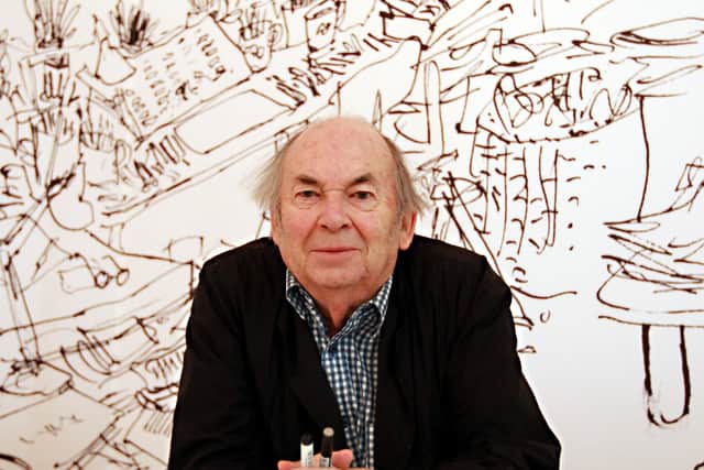 Sir Quentin Blake poses with some of his illustrations.