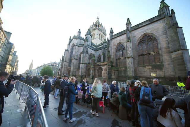 People gather outside St Giles' Cathedral, in Edinburgh, ahead of the Procession of Queen Elizabeth's coffin from the Palace of Holyroodhouse to the cathedral. (Pic: Peter Byrne/PA Wire)