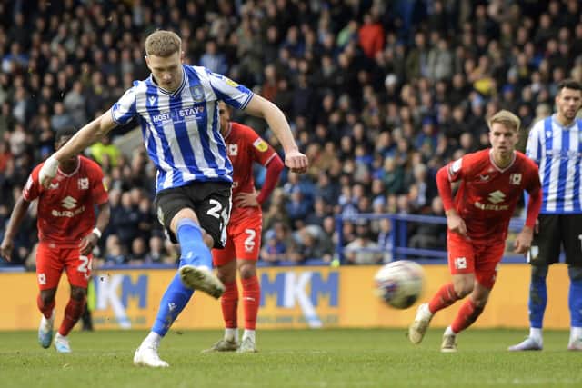 TIMELY: Michael Smith scores Sheffield Wednesday's second goal against Milton Keynes Dons from the penalty spot Picture: Steve Ellis