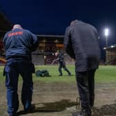 PITCH BATTLES: Bradford City groundstaff work on the Valley Parade pitch before the Football League Trophy semi-final against Wycombe Wanderers last month. Picture: Tony Johnson.