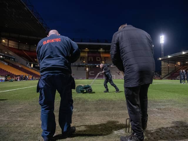 PITCH BATTLES: Bradford City groundstaff work on the Valley Parade pitch before the Football League Trophy semi-final against Wycombe Wanderers last month. Picture: Tony Johnson.