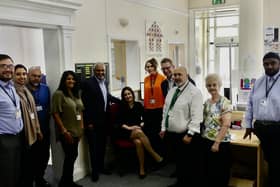 Carolina Padovezi de Oliveira, Manningham Housing Association corporate project manager (seated), with staff team members.