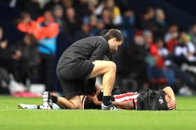 Sheffield United forward Rhian Brewster receives treatment for an injury before being substituted against West Brom. Picture: Bradley Collyer/PA Wire.
