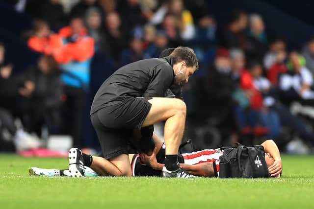 Sheffield United forward Rhian Brewster receives treatment for an injury before being substituted against West Brom. Picture: Bradley Collyer/PA Wire.