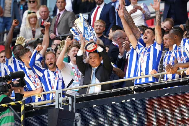 HIGH TIME: Sheffield Wednesday owner Dejphon Chansiri (centre) celebrates with League One Play-off trophy following victory over Barnsley last month at Wembley Stadium Picture: Nick Potts/PA