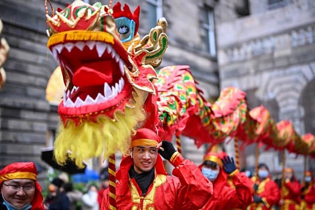 Members of the Scottish Chinese community take part in Edinburgh Chinese New Year Festival in 2022. (Pic credit: Jeff J Mitchell / Getty Images)