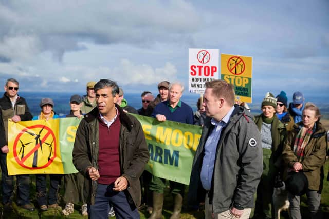 Rishi Sunak and Sam Rushworth with campaigners on Hope Moor.