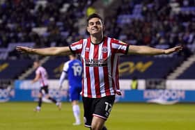 Sheffield United's John Egan celebrates scoring their side's first goal of the game during the Sky Bet Championship match at the DW Stadium, Wigan. Picture: Tim Goode/PA Wire.
