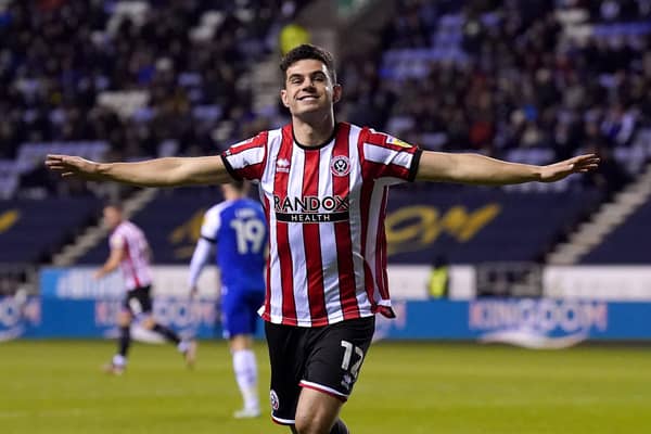 Sheffield United's John Egan celebrates scoring their side's first goal of the game during the Sky Bet Championship match at the DW Stadium, Wigan. Picture: Tim Goode/PA Wire.