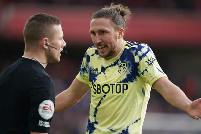 Leeds United's Luke Ayling gestures to referee Robert Jones during the Premier League match at the City Ground, Nottingham. Picture date: Sunday February 5, 2023. PA Photo. See PA story SOCCER Forest. Photo credit should read: Mike Egerton/PA Wire.

RESTRICTIONS: EDITORIAL USE ONLY No use with unauthorised audio, video, data, fixture lists, club/league logos or "live" services. Online in-match use limited to 120 images, no video emulation. No use in betting, games or single club/league/player publications.