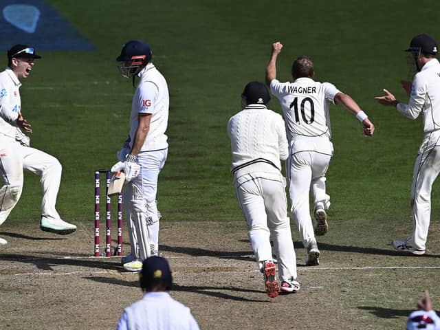 GOT HIM: New Zealand's Neil Wagner, second right, celebrates with team-mates after taking the wicket of England's James Anderson, second left, to win the second Test in Wellington by one run Picture: Andrew Cornaga/Photosport via AP