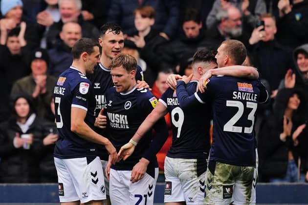 Millwall's Tom Bradshaw (second right) celebrates scoring their side's third goal of the game, completing his hat-trick, during the Sky Bet Championship match at The Den, London. Picture: Victoria Jones/PA Wire