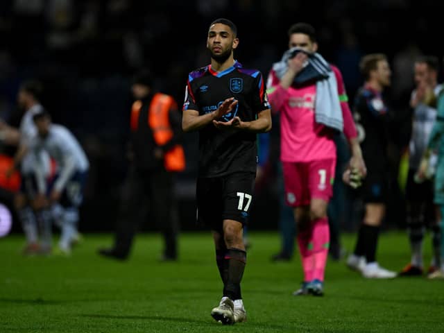Huddersfield Town's Brodie Spencer cuts a dejected figure after the Terriers' heavy Roses loss at Preston North End, which represented a blow to their Championship survival hopes. Photo by Gareth Copley/Getty Images.