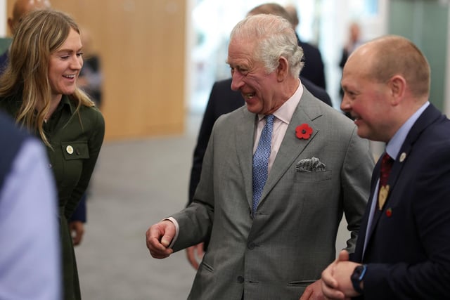King Charles III laughs during a visit to the head office of Morrisons in Bradford. Photo credit: Russell Cheyne/PA Wire