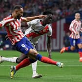 Atletico Madrid's Brazilian forward Matheus Cunha (L) kicks the ball during the Spanish league football match between Club Atletico de Madrid and Rayo Vallecano de Madrid at the Wanda Metropolitano stadium in Madrid on October 18, 2022. (Photo by OSCAR DEL POZO CANAS/AFP via Getty Images)
