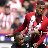 SCARMBLE: Max Lowe of Sheffield United challenges Crystal Palace's Jordan Ayew