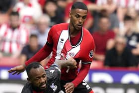 SCARMBLE: Max Lowe of Sheffield United challenges Crystal Palace's Jordan Ayew