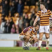 So close: Bradford City captain Richie Smallwood consoles Sam Stubbs at the final whistle as they lose the chance to go to Wembley (Picture: Tony Johnson)