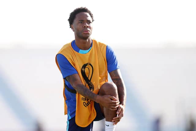 DOHA, QATAR - NOVEMBER 24: Raheem Sterling of England stretches during the England Training Session at Al Wakrah SC Stadium on November 24, 2022 in Doha, Qatar. (Photo by Alex Pantling/Getty Images)