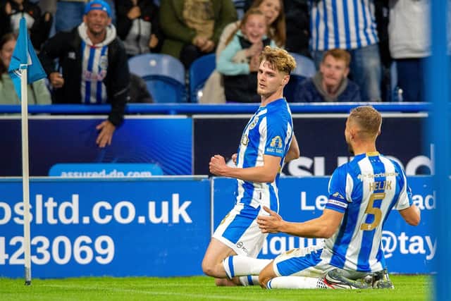 Jack Rudoni is pictured celebrating scoring Huddersfield Town's equaliser versus Stoke City last month. The midfielder's fitness is being monitored ahead of the weekend derby at Leeds United. Picture: Bruce Rollinson.