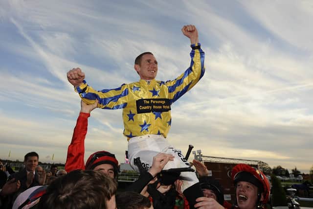 MAGIC MOMENT: Jockey Paul Hanagan is lifted into the air at Doncaster Racecourse in November 2010by his colleagues after winning the flat jockeys championship by riding the most winners in the season. Picture: Alan Crowhurst/ Getty Images