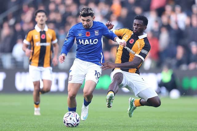 DIVING IN: Tim Iroegbunam tackles Julio Enciso (Image: George Wood/Getty Images)