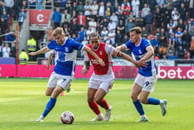 Rotherham United forward Sam Nombe (centre) tussles with Birmingham City duo Emil Hansson and Taylor Gardner-Hickman in last Saturday's League One game. Picture: Tony Johnson.