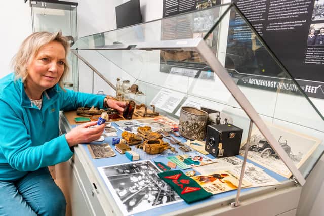 Kathy Allday, Chair of Knaresborough Museum Association looking at items in the WW2 cabinet