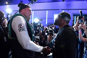 STRATFORD, ENGLAND - NOVEMBER 29: Tyson Fury and Derek Chisora shake hands during the media work out ahead of Tyson Fury v Derek Chisora at BT Studios on November 29, 2022 in Stratford, England. (Photo by Tom Dulat/Getty Images)