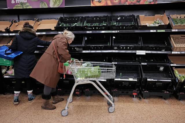 Empty fruit and vegetable shelves at an Asda in east London. A shortage of tomatoes affecting UK supermarkets is widening to other fruit and vegetables and is likely to last weeks, retailers have warned.