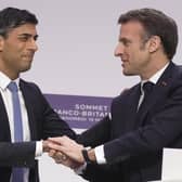 French President Emmanuel Macron, (right), and Britain's Prime Minister Rishi Sunak shake hands during a joint news conference at the Elysee Palace last year. PIC: Kin Cheung - Pool/Getty Images