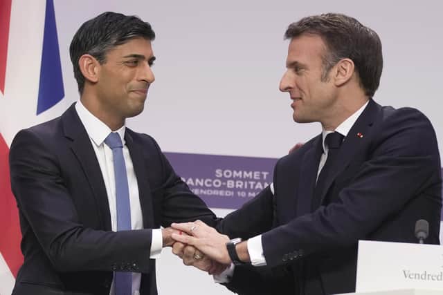 French President Emmanuel Macron, (right), and Britain's Prime Minister Rishi Sunak shake hands during a joint news conference at the Elysee Palace last year. PIC: Kin Cheung - Pool/Getty Images
