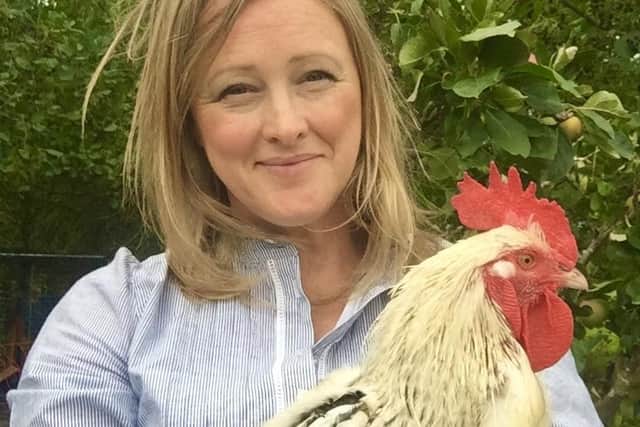 Author Sally Coulthard with cockerel Andy