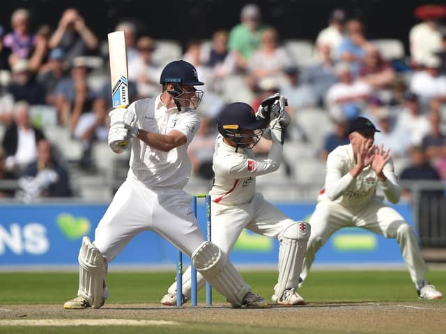 Finlay Bean cuts the ball away during the Roses match at Old Trafford. The young Yorkshireman made an excellent impression on his first-class debut. Photo by Nathan Stirk/Getty Images.