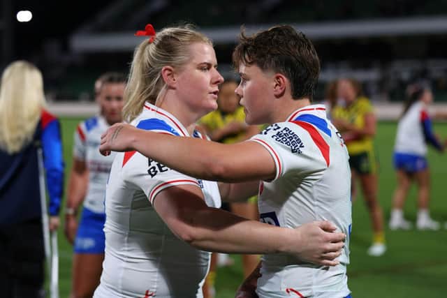 England's Vicky Whitfield and Molly Jones as their side loses to Australia.