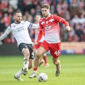 Barnsley striker John McAtee takes on Derby captain and ex-Reds favourite Conor Hourihane in a league game in February. Picture: Tony Johnson.