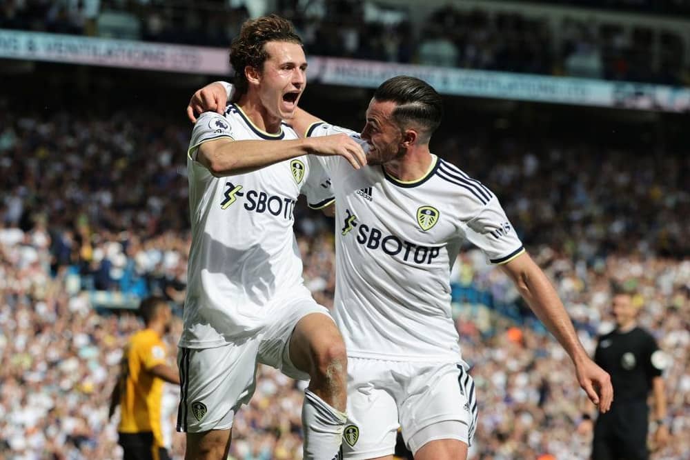 WINNER: Brenden Aaronson celebrates with Jack Harrison