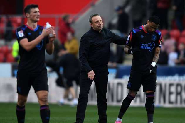 Huddersfield Town head coach André Breitenreiter pictured at the final whistle at Rotherham United as away fans make their feelings known. Picture: Jonathan Gawthorpe