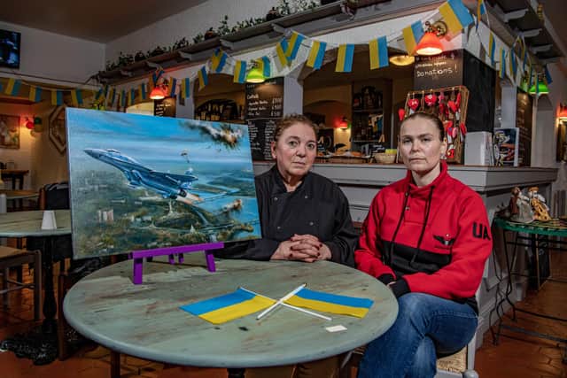 Ukrainians Lena Sutherland and her friend Viktoriia Zhelikhovska at Lena's Kitchen in Hull on the first anniversary of the invasion by Russia. Viktoriia’s husband, Alex Krylovis is fighting in Ukraine but  she is doing an exhibition of her father's work to raise funds for nations army. 
 Tony Johnson photographed the friends for The Yorkshire Post. 22nd February 2023